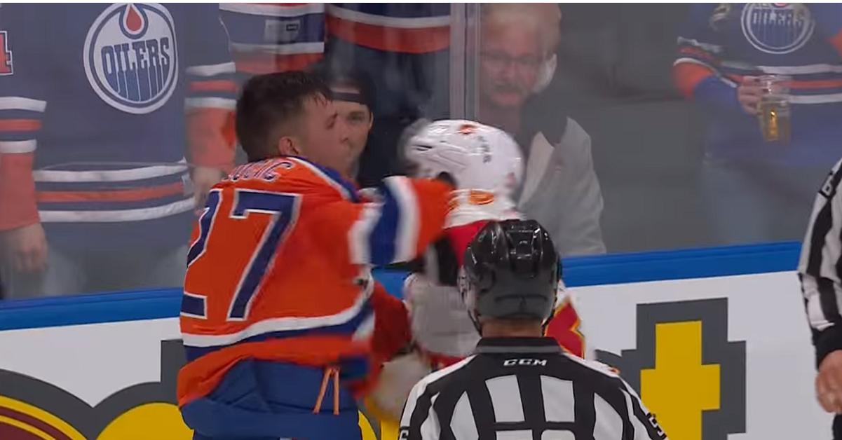 McDavid takes a hit in season opener and big bad Lucic comes to the rescue.