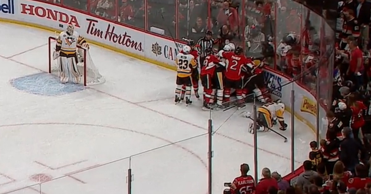 Bobby Ryan destroys Penguins defenseman moments after refs fail to call a penalty. 