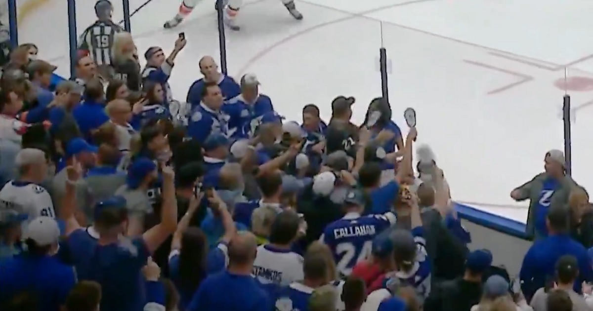 Brawl breaks out between fans in the crowd for Game 7.