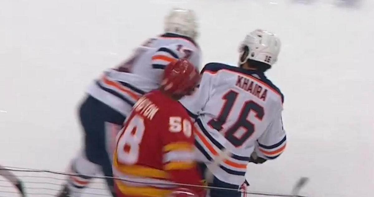 Jujhar Khaira takes out Oliver Kylington with a big hit to the head.