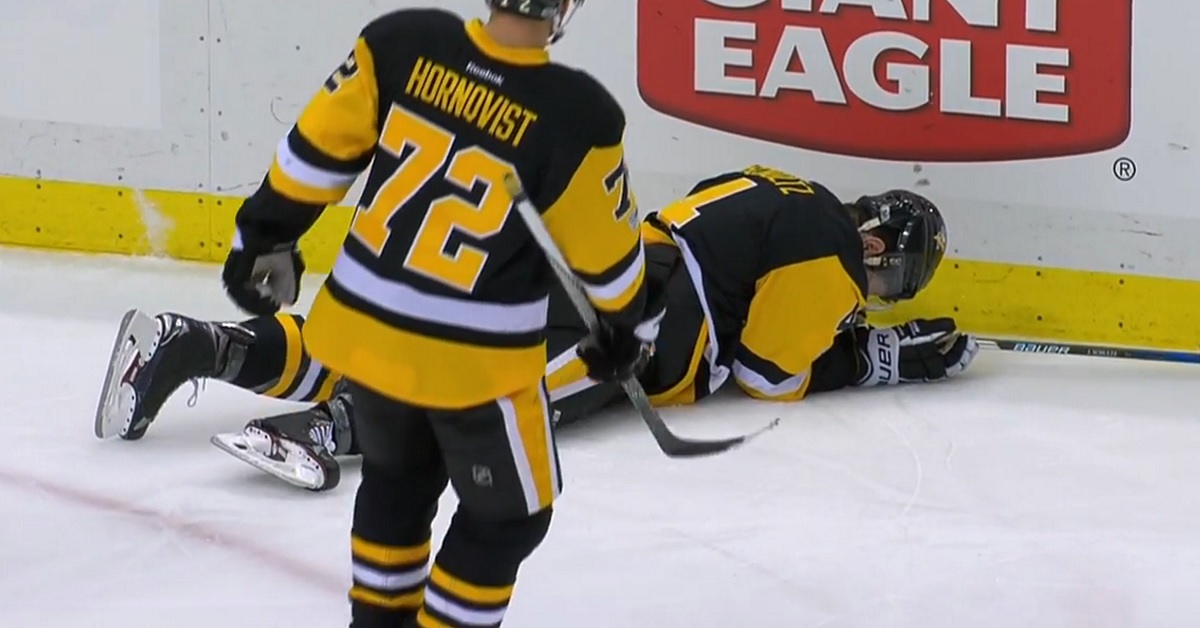 NHLer goes down after a hit from big Dustin Byfuglien.