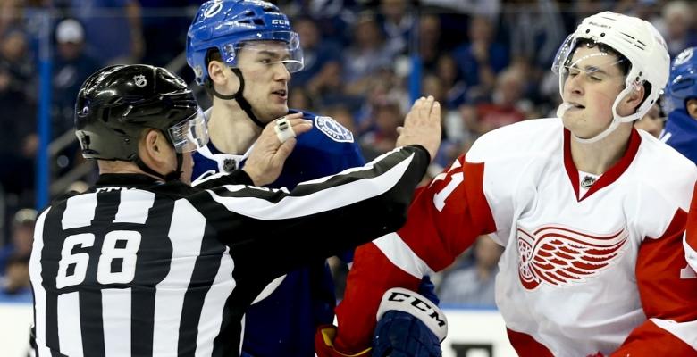 Dylan Larkin busts open Jonathan Drouin with an open ice hit.