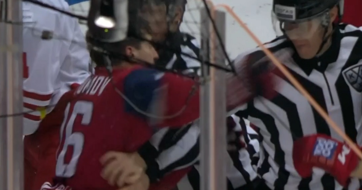 NHL prospect punches referee in the face after a nasty hit to the head.