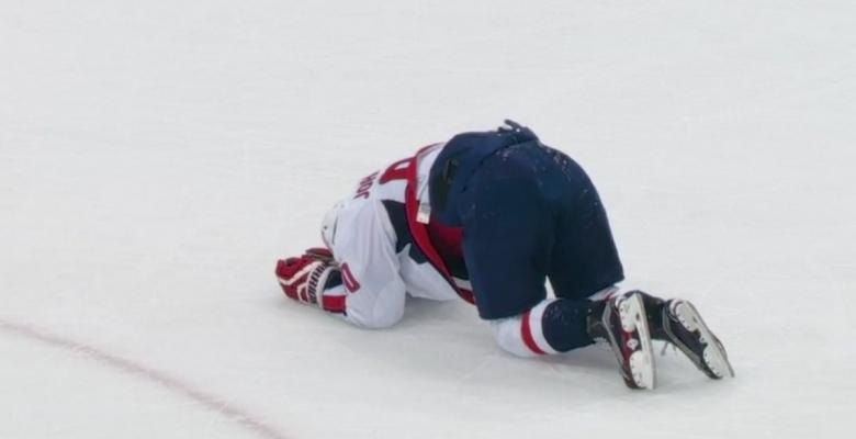Kris Letang takes out a Capital with a leaping hit to the head.