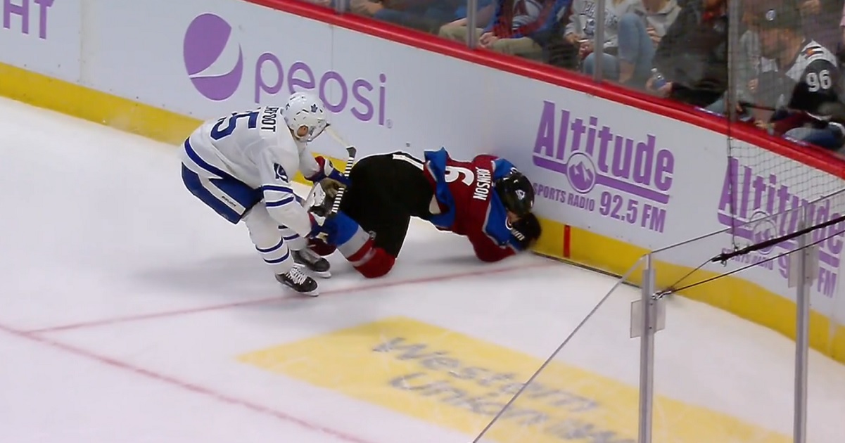 Alex Kerfoot sends Erik Johnson head first into the boards.