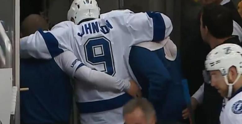 Tyler Johnson reacts awkwardly to incoming hit and gets injured.