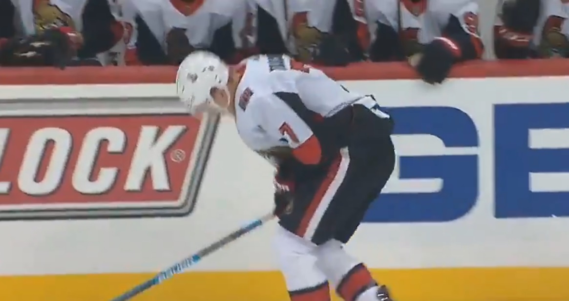 Brady Tkachuk hurts himself while trying to crosscheck Jake Guentzel.