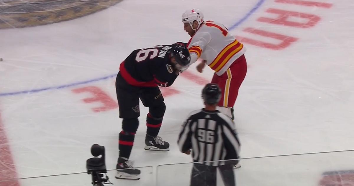 Milan Lucic manhandles Austin Watson.