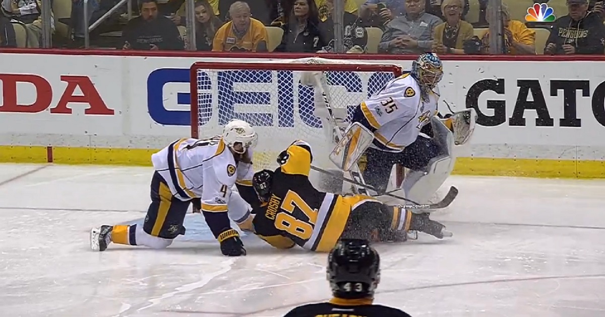 Crosby ends up in the back of the Predators net after minor contact from Ellis.
