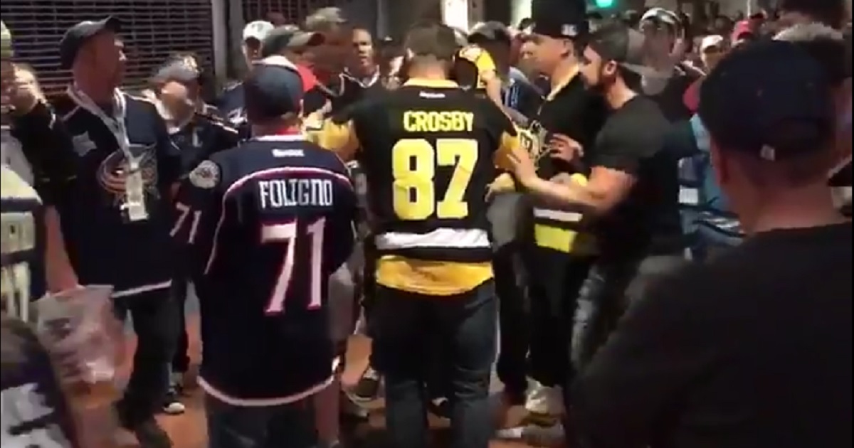 Crosby fan caught sucker punching another fan at the game.