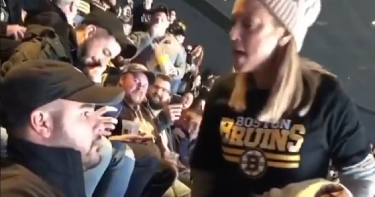 Bruins fan goes mental after someone spills food on her at the game.