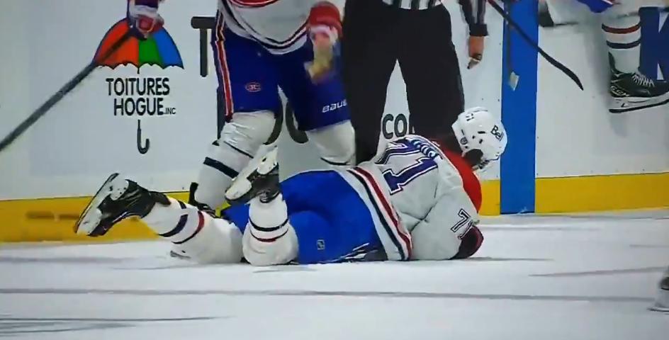 Jake Evans laid out after a high hit from Gudbranson.