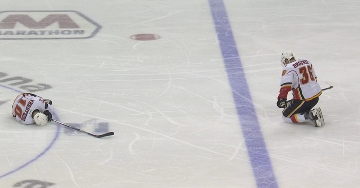 Huge collision between two teammates leaves veteran writhing in pain on the ice.