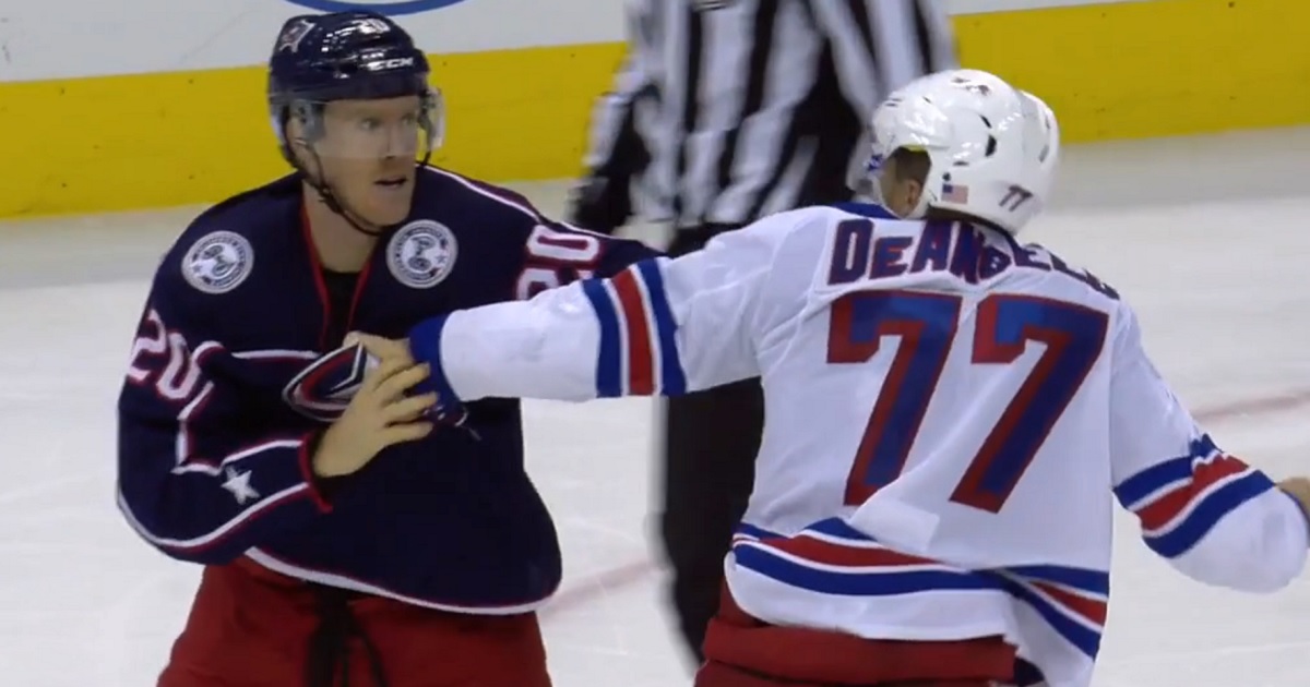 Nash and DeAngelo trade big hits and then drop the gloves.