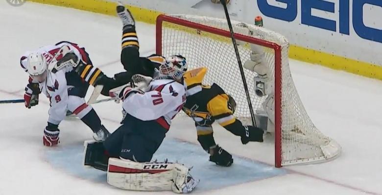 Hit on Hagelin sends him flying into Braden Holtby.
