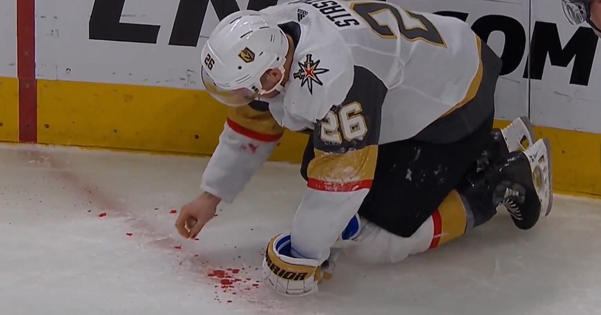 Paul Stastny forced to pick his teeth up off the ice after taking a wicked shot to the face.