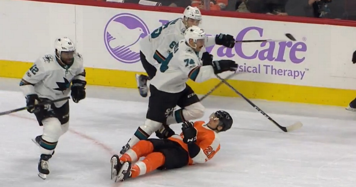 Laughton injured after taking a questionable hit and a knee to the head.