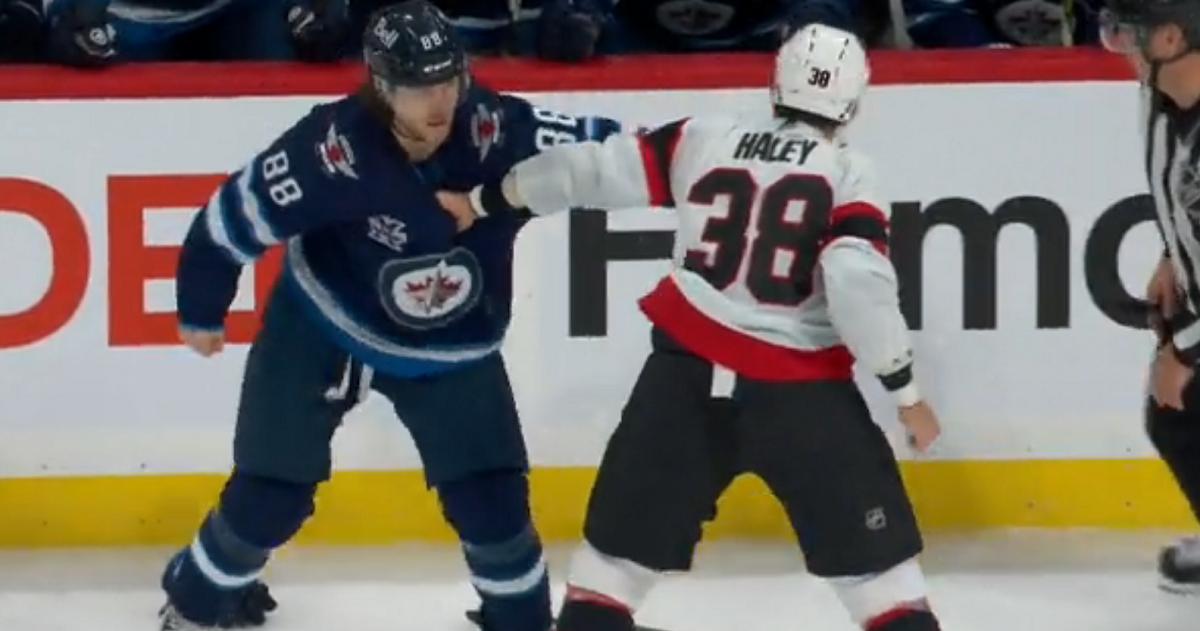 Beaulieu and Haley throwdown in front of the Jets bench.
