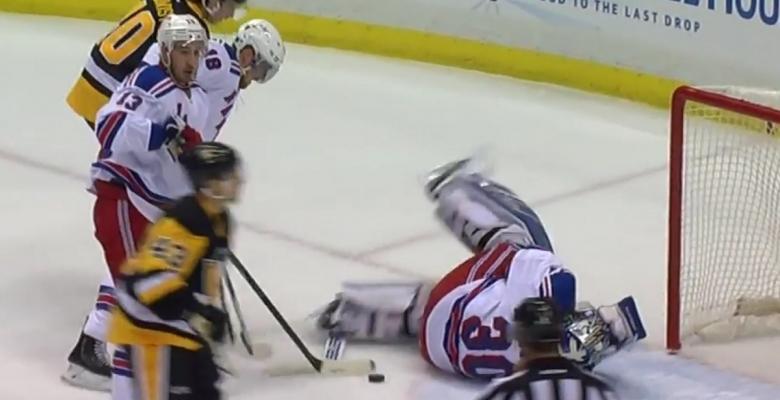 Lundqvist gives up a goal after being poked in the eye by his teammate.