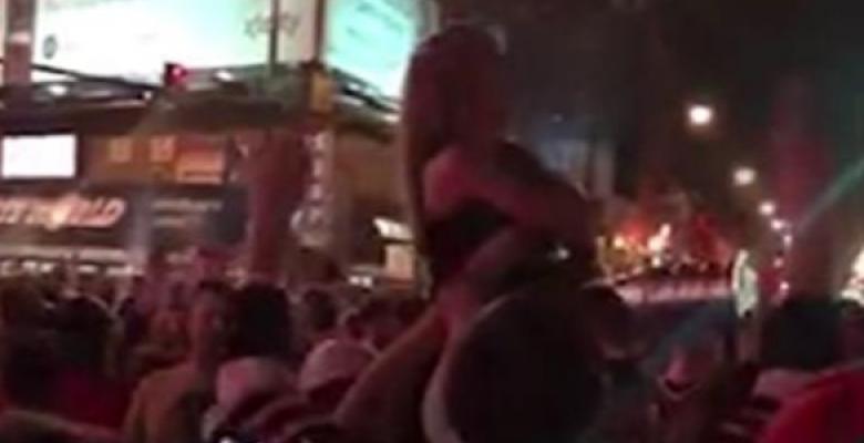 Beautiful Blackhawks' fan takes her top off in celebration.