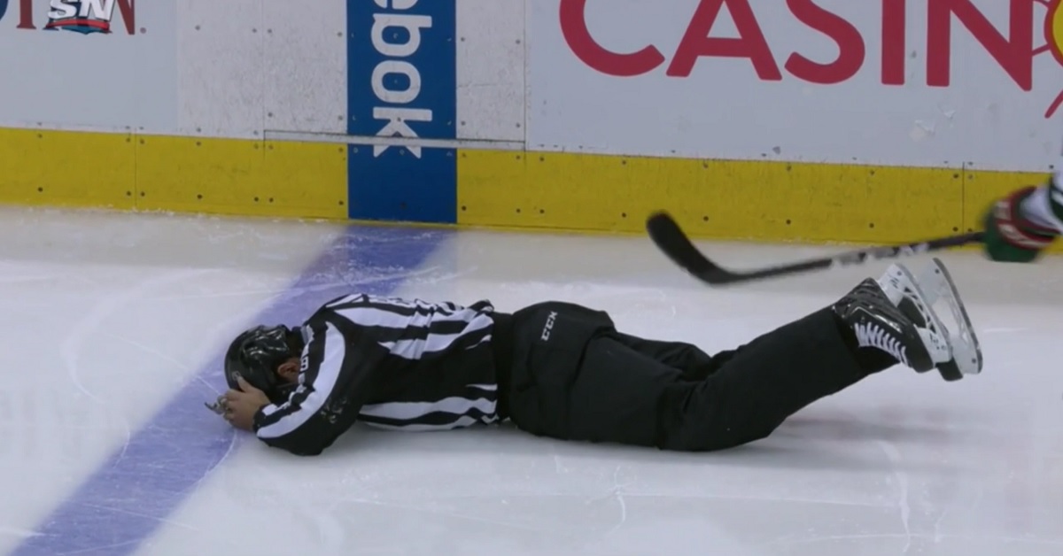 Linesman left writhing in pain after getting nailed by a shot.