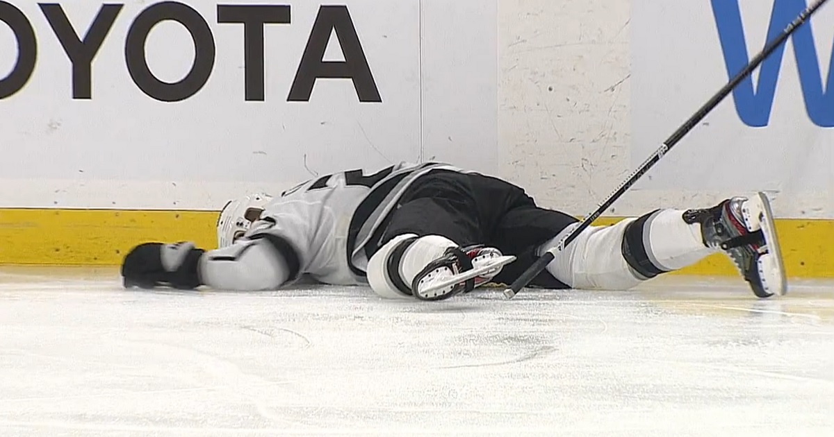 Trevor Lewis knocked out after brutal collision with Rasmus Asplund.