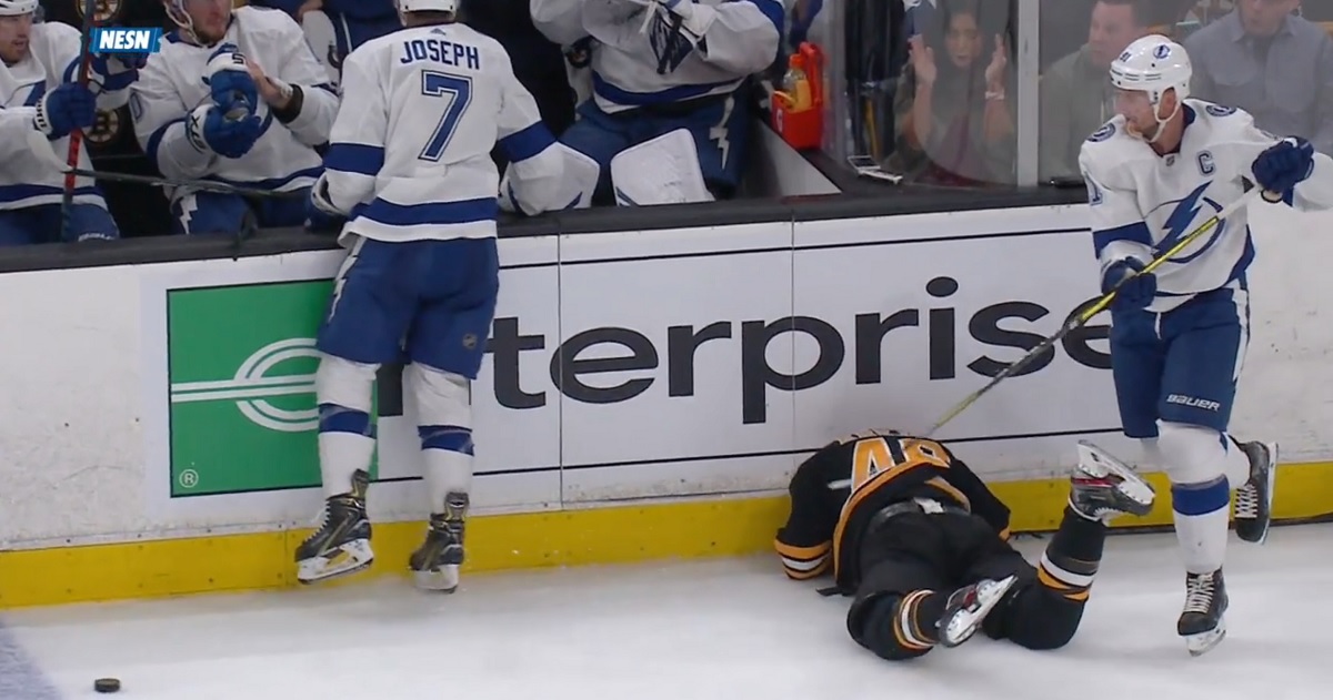 Joseph sends Krejci head first into the boards and draws a crowd.