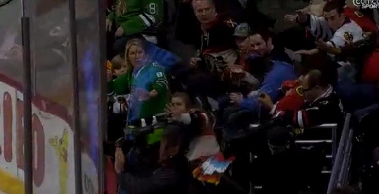 (VIDEO): Blackhawks fan cut by flying glass, chooses to finish game without stitches!